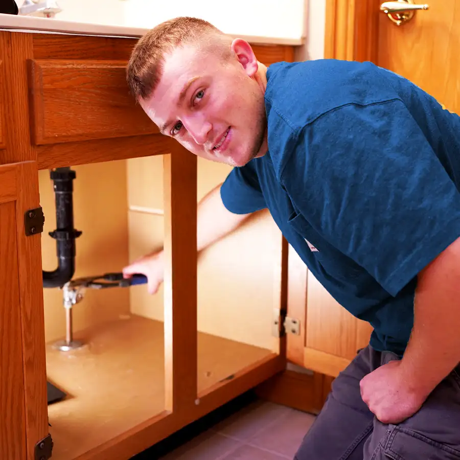 Plumber fixing a bathroom sink