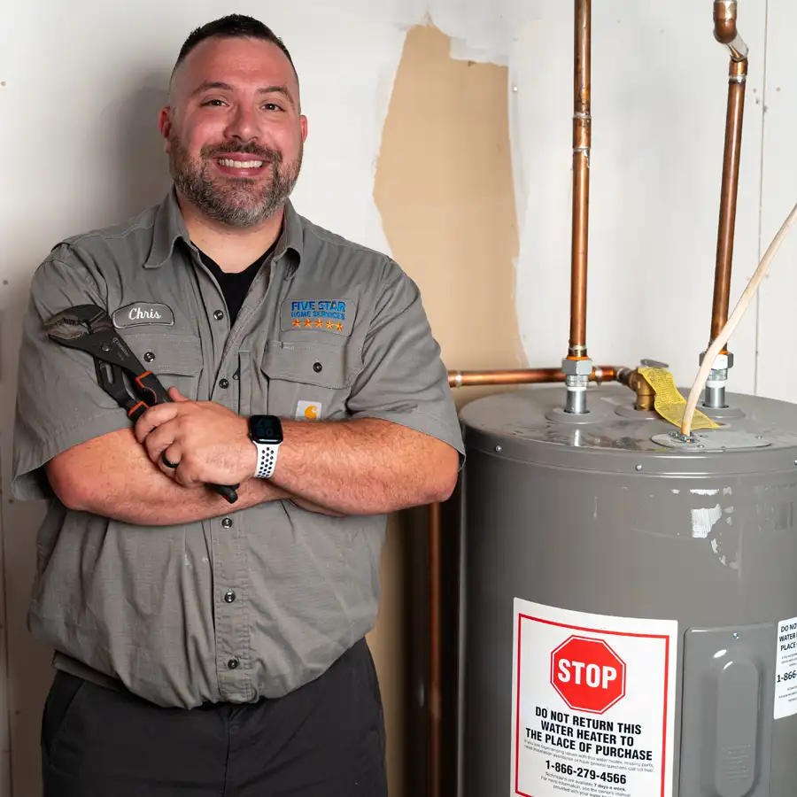 Plumber standing to a water heater